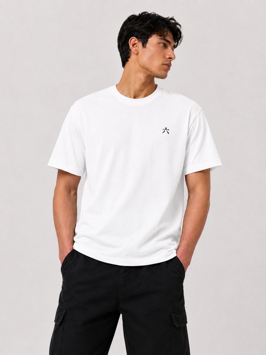 Male model wearing the white 6SENSE by ROKURA oversized t-shirt with minimalist kanji logo on the chest.